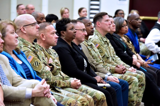 U.S. Army Mission Installation Contracting Command key leaders listen to speakers during a quarterly town hall Feb. 18, 2025, in Blesse Auditorium, Joint Base San Antonio – Fort Sam Houston, Texas. The MICC command group, Col. Freddy Adams, Clay...