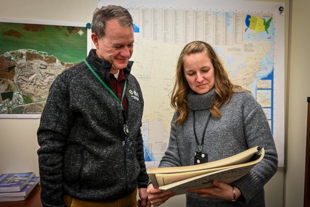 Jamie Todt, civil engineer at the Transportation Engineering Agency, meets with her supervisor, Doug Briggs. Todt plays a critical role in maintaining the Strategic Highway Network, coordinating with military installations and state agencies to...