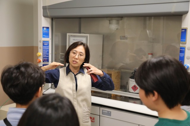 USACE FED employee with children in lab