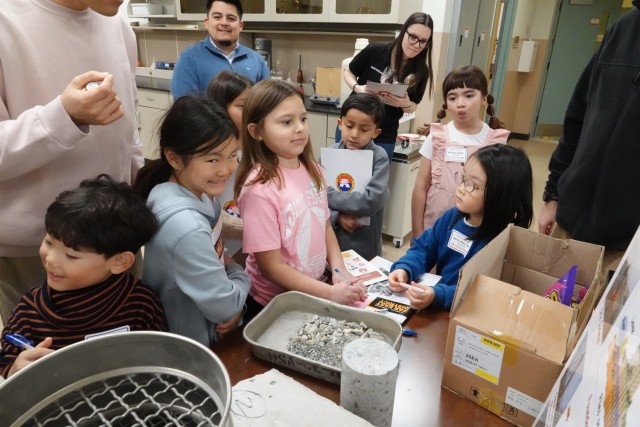 USACE FED employee with children in lab