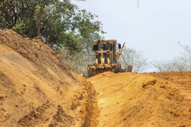 A Thai marine, assigned to the Royal Thai Marine Corps, scrapes up dirt for a road rehabilitation project during Joint Exercise Cobra Gold 2025 at Ban Chan Khrem, Chanthaburi Province, Thailand, Feb. 20, 2025. Regular exercises and engagements...