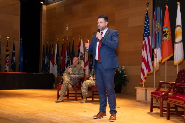 U.S. Communications-Electronics Command Transformation Director Andrew Rehkop discusses the Army’s continuous transformation model, while CECOM Commanding General Maj. Gen. James D. Turinetti IV looks on during the CECOM town hall at the Myer...