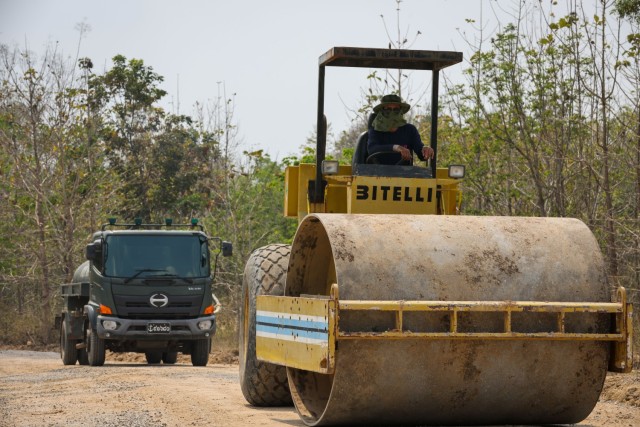 A Thai marine, assigned to the Royal Thai Marine Corps, Construction Company of Combat Engineers, rolls up gravel for a road rehabilitation project during Joint Exercise Cobra Gold 2025 at Ban Chan Khrem, Chanthaburi Province, Thailand, Feb. 20,...