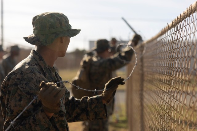 U.S. Marines provide support to Illegal Aliens Holding Operations at Guantanamo Bay