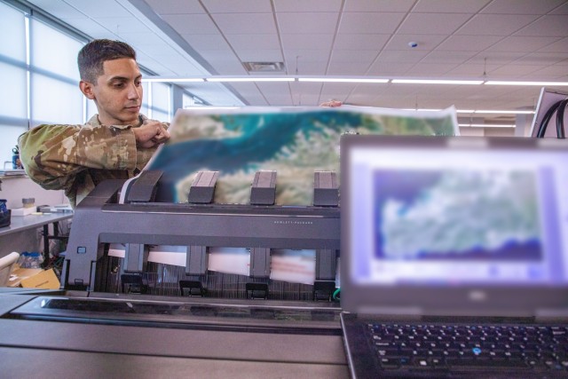 A geospatial engineer with Joint Task Force Southern Guard prints area maps at Naval Station Guantanamo Bay, Cuba, Feb. 22, 2025. Joint Task Force Southern Guard is supporting illegal aliens holding operations led by the Department of Homeland...