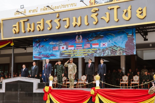 Robert F. Godec, the United States Ambassador to Thailand, and  General Ronald P. Clark, the commanding general of the United States Army Pacific, render honors during the playing of the U.S. National Anthem during the Cobra Gold 2025 opening...