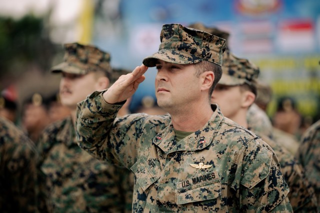 U.S. Marines salute during the playing of the National Anthem at the Cobra Gold 2025 opening ceremony in Camp Suranaree, Thailand, February 25, 2025. The opening ceremony marks the 44th iteration of Cobra Gold, which started in 1982 and is the...