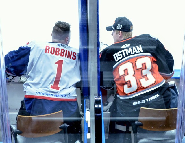 Capt. Micah Robbins, an operations officer with the Mission Command Training Program at Fort Leavenworth, Kansas, talks with KC Mavericks goalie Victor Ostman, from Danderyd, Sweden, prior to KC Mavericks vs. Allen Americans hockey game Feb. 19,...