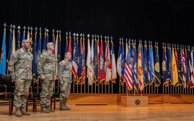 Former Fort Knox Garrison Command Sgt. Maj. Sherman Waters, Fort Knox Garrison Commander Col. Chris Ricci and Incoming Fort Knox Garrison Command Sgt. Maj. Alex Licea sing the Army song during the conclusion of the Garrison Change of...