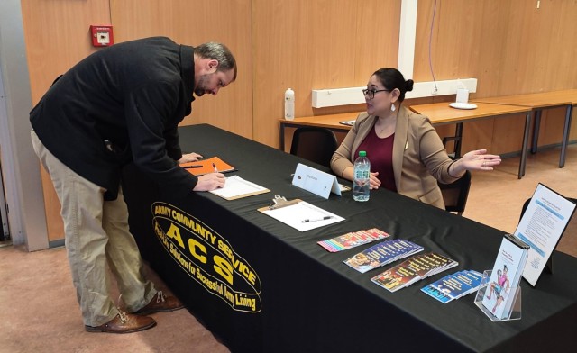 An ACS volunteer checks in an applicant to the Mini Job Fair.