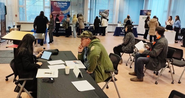 Employment Readiness Program Specialist Jasmin Lazo reviews resumes for applicants at the Mini Job Fair.