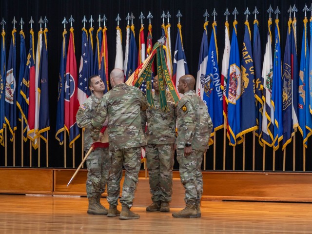 Fort Knox Garrison Commander Col. Chris Ricci passes the Garrison colors to Command Sgt. Maj. Alex Licea during the garrison change of responsibility ceremony at Fort Knox, Kentucky on Feb. 28, 2025. CSM Licea replaced CSM Sherman Waters, Jr. as...