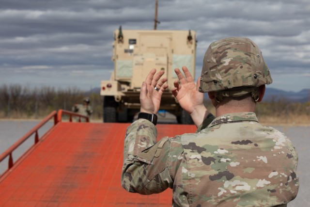 A U.S. Soldier assigned to the 10th Mountain Division guides a High Mobility Multi-Wheeled Vehicle at Fort Huachuca, Arizona, Feb. 13, 2025. U.S. Northern Command is working together with the Department of Homeland Security to augment U.S. Customs...