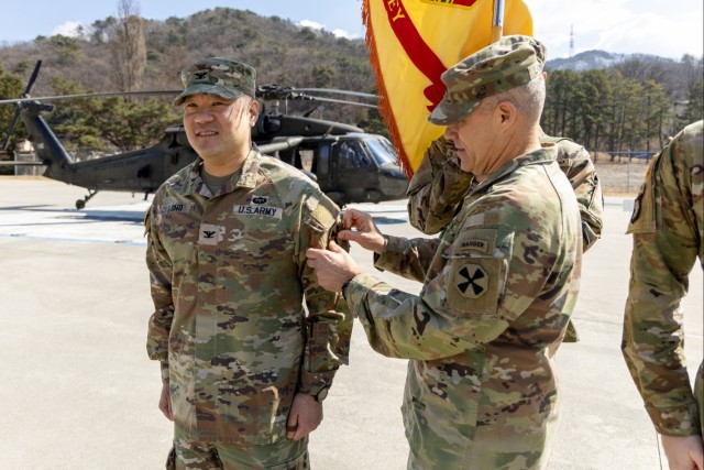 Army garrison Soldiers in Korea don Eighth Army patches