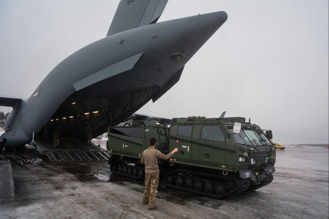 Multinational Armed Forces Offload Gear and Equipment in Support of Arctic Forge 25