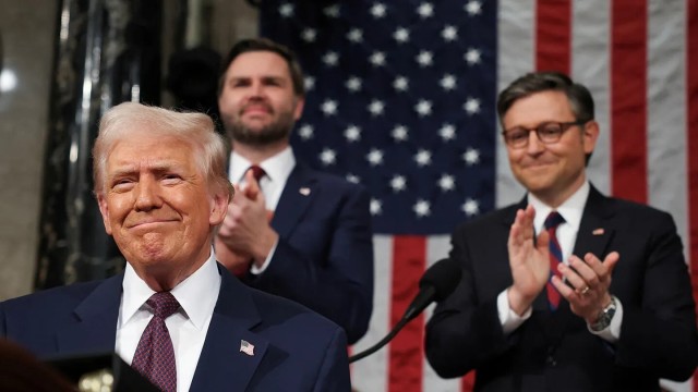 Flanked by Vice President JD Vance and House Speaker Mike Johnson, President Donald J. Trump congratulates high school student Jason Hartley on his acceptance to the U.S. Military Academy during his joint address to Congress, March 4, 2025.