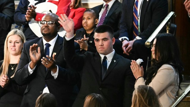 Upon learning of his acceptance to the United States Military Academy, high school student Jason Hartley waves to the crowd during President Donald J. Trump’s joint address to Congress, March 4, 2025.