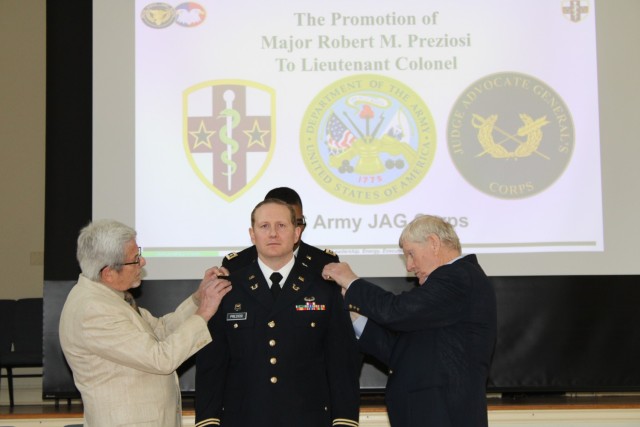 MORRISTOWN, N.J. - Robert Preziosi is promoted to the rank of lieutenant colonel by his mother’s cousin, Edward Wilbeck Jr., (left) and father, Paul (right), during a ceremony at the Washington’s Headquarters Museum in Morristown on March 8.