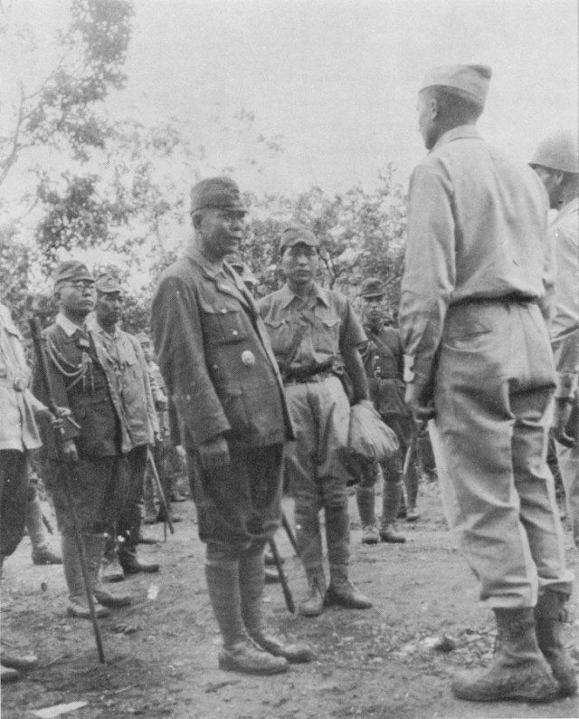 Gen. Tomoyuki Yamashita, commander of all Japanese forces in the Philippines during WWII, as he surrenders to Col. Ernest A. Barlow, chief of staff of the 32nd Infantry Division, at Kiangan, Luzon, on Sep. 2, 1945. (Courtesy Photo)