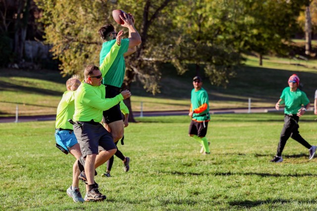 Natural Resources specialist Hunter Young (jumping) and LTC Paul Brownhill facing off in the Kansas City District’s annual Turkey Bowl in Nov. 2024.