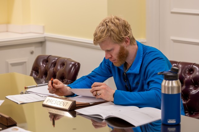 Hydraulic engineer and FY25 LDP participant Micheal Mansfield as President Truman meticulously going over his intelligence package before meeting with his cabinet to decide the fate of the world during the “End the War with Japan” simulation...