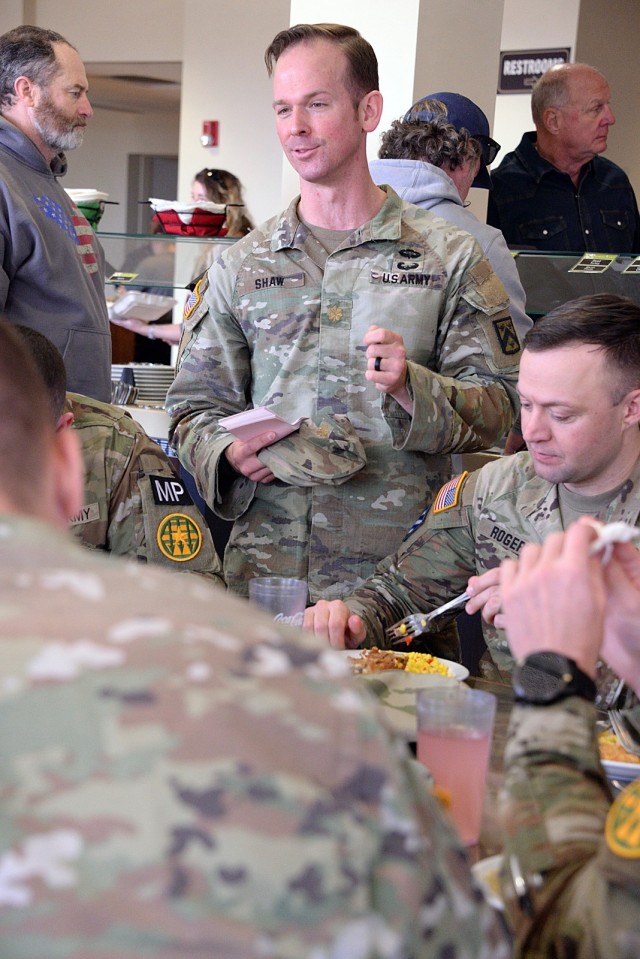 Maj. Jonathan Shaw, Special Troops Battalion executive officer and Army Emergency Relief campaign coordinator, talks about AER with Army Corrections Brigade soldiers, including Capt. Rich Rogers, B Company, U.S. Disciplinary Barracks Battalion...