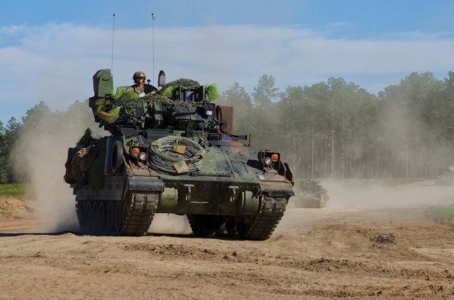 U.S. Army Soldiers assigned to 1st Battalion, 64th Armor Regiment, 1st Armored Brigade Combat Team, 3rd Infantry Division support 2nd Brigade Combat Team, 82nd Airborne Division, using M2A4 Bradley Fighting Vehicles during Joint Readiness Training...
