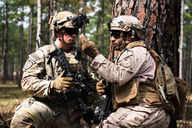 A U.S. Army 3rd Security Force Assistance Brigade Soldier and United Arab Emirates 11th Mountain Battalion soldier coordinate movement during Joint Readiness Training Center Rotation 23-04, Fort Polk, LA, Feb., 21, 2023. UAE soldiers from the 11th...
