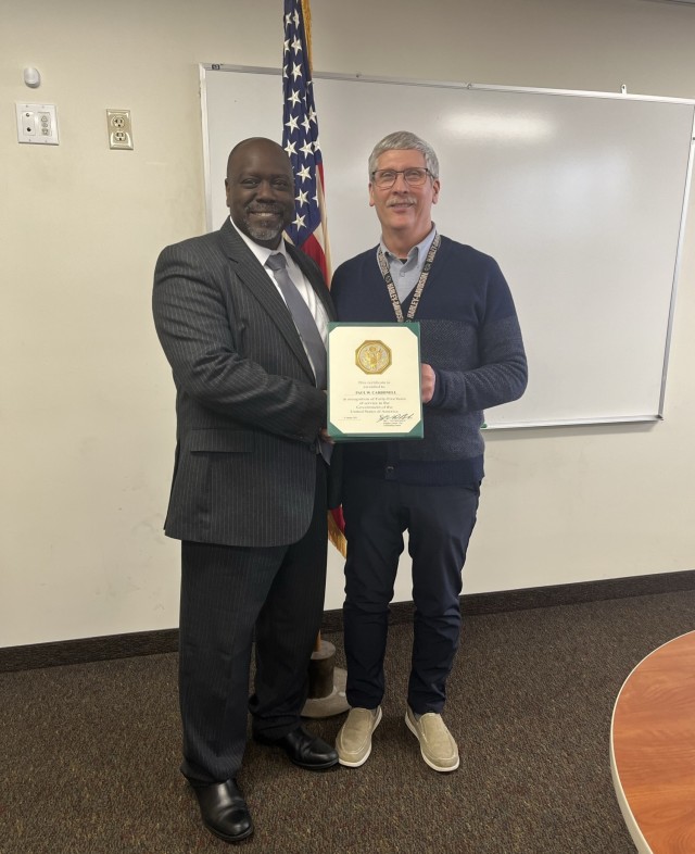 Paul Carbonell honored for 45 years of service by 7th Signal Command (Theater)