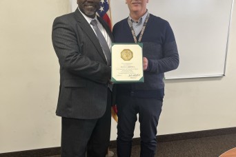 45 Years of Dedication Recognized: Paul Carbonell Receives Award from 7th Signal Command (Theater)