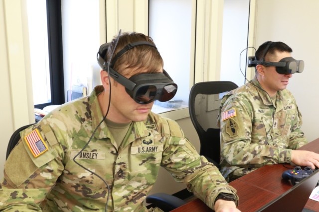 Sgt. 1st Class Jared Tansley uses a virtual reality program to simulate Observer Coach/Trainer duties at the First Army OC/T Academy.