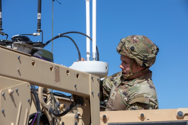 A U.S. Army Soldier adjusts a supporting next generation antenna on top of a tactical vehicle during Project Convergence – Capstone 5 (PC-C5) at Fort Irwin, Calif. PC-C5 is an Army-hosted experiment that allows our Joint partners and...