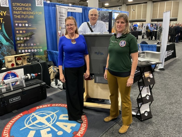Photo Caption: Kate Williams, right, LEAD director of strategic management, talked shop with Big Mac Enterprises, LLC, an awardee of the Army SBIR Shop Tools and Enablers Open Topic, at the DoD Maintenance Symposium in December 2024 (Credit:...