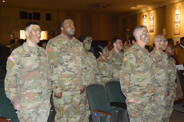 The inductees stand reciting the NCO Creed at the APG Post Theater on March 7, 2025. Back row from left to right: SGT Ryan Conway, SGT Gabriel Williams, SGT Samanta Ann Pean, SGT Brianna Cruz, CPL Michael Giuffrida and CPL Noah Perez. Front row...