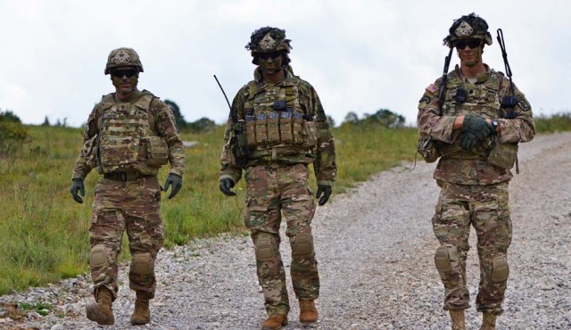 Lt. Col. Jim D. Keirsey (right), commander of 2nd Battalion, 503rd Infantry Regiment, 173rd Airborne Brigade, walks with Command Sgt. Maj. Wayne W. Wahlenmeier (center) and Capt. John P. McDougall (left), unit chaplain, in Postojna, Slovenia, July...