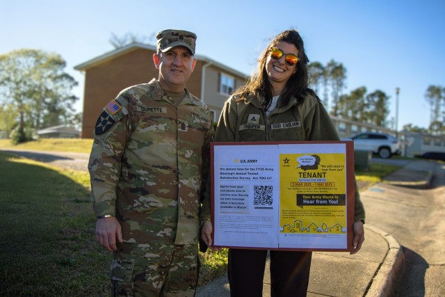 Command Sgt. Maj. Daniel Durette and Sylvia Thigpen, program analyst with the Fort Eisenhower Housing Team, promote the Tenant Satisfaction Survey during the Walking Town Hall on March 17, 2025, in Azalea Terrace. The survey helps shape housing...