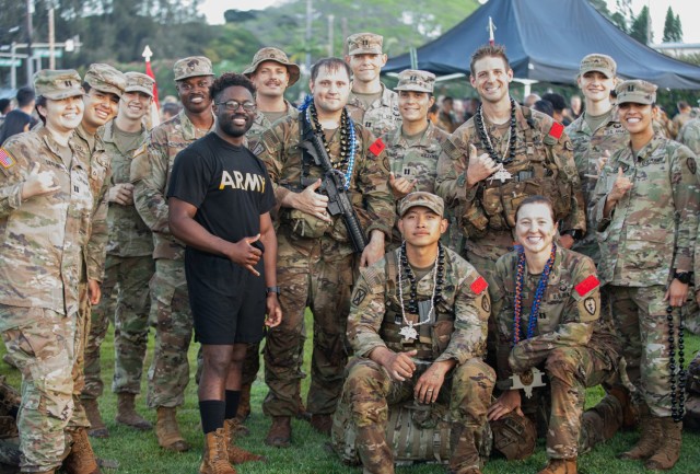 U.S. Army Soldiers assigned to the 25th Infantry Division pose for a group picture in celebration for their Soldiers who successfully obtained one of the Expert Infantry, Expert Soldier, and Expert Field Medical badges, (E3B), on Schofield...