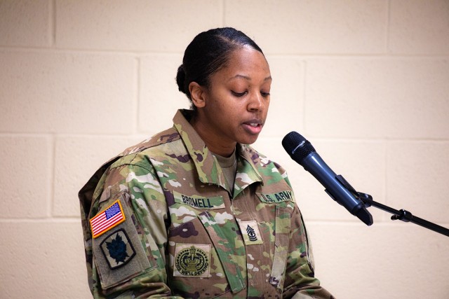 New 7th Signal Command (Theater) HHC First Sgt. Candice Bromell makes remarks following her assumption of responsibility from Master Sgt. David Walik.
