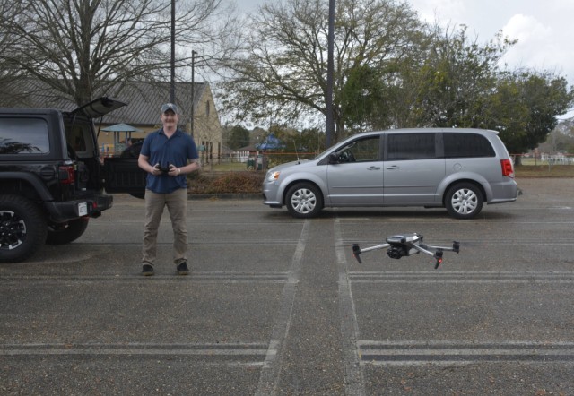 Casey Miller from Global Operations Support and Threat lands a small drone used as an opposing force asset during the exercise at Fort Novosel. The small drones were used to simulate an attack on the installation so security forces could learn to...