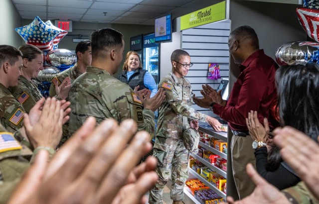 A 1st Theater Sustainment Command Speclialist completes the first purchase on the new 1st TSC barracks mini market at Fort Knox, Kentucky, March 20, 2025. The market was installed on the 13th and a ribbon cutting ceremony was held the following...
