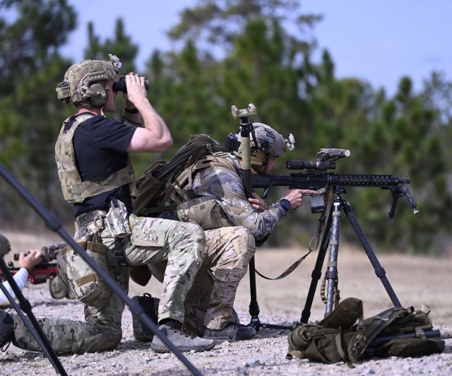 Competitors in the 16th Annual United States Army Special Operations Command International Sniper Competition engage long-distance targets on a range at Fort Bragg, North Carolina, March 17, 2025. Twenty-one teams competed in the USASOC...