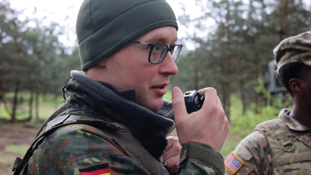 A German soldier speaks into a radio attached to a Radio Integration Communications Suite (RICS) during Saber Strike 24 on 18 April 2024.