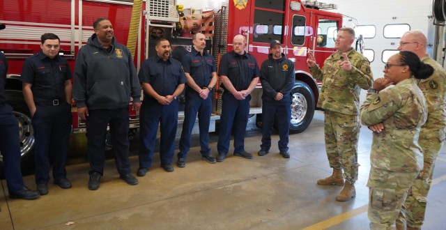 Maj. Gen. Trevor Bredenkamp, commanding general, Military District of Washington, thanks Joint Base Myer-Henderson Hall firefighters for their response to the crash near Reagan National Airport Jan. 29.