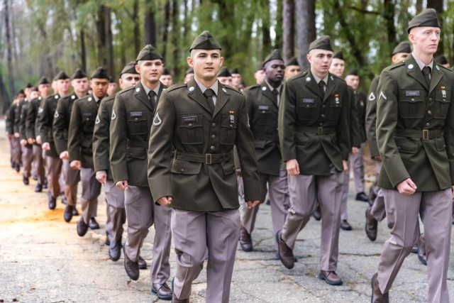 Pfcs. Andrews and Angel Rodriguez march with their platoon during their Turning Blue Ceremony March 13, 2025, on Pomeroy Field at Fort Benning, Georgia.