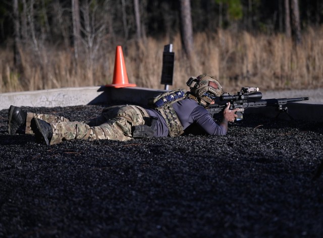 A competitor in the 16th Annual United States Army Special Operations Command International Sniper Competition engages long-distance targets on a range at Fort Bragg, North Carolina, March 18, 2025. Twenty-one teams competed in the USASOC...