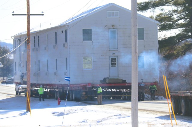 A barracks building from the 1600 block at Fort McCoy, Wis., is shown being moved Feb. 13, 2025, from the 1600 block to another area of the installation. Contractors are moving several buildings in January and February 2025. These buildings will...