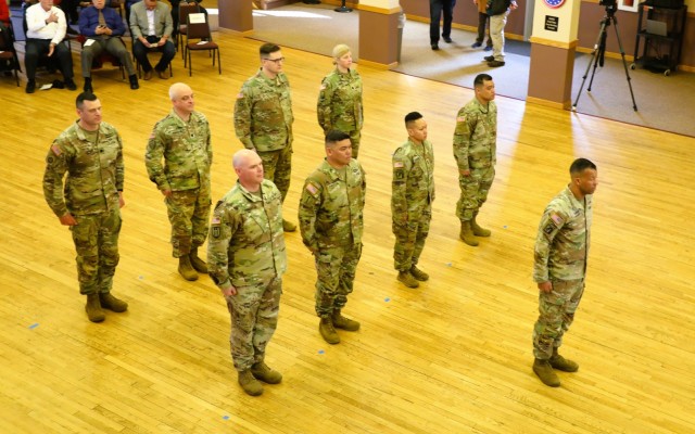 A scene from a patching ceremony held March 13, 2025, is shown in building 905 at Fort McCoy, Wis. Soldiers with U.S. Army Garrison-Fort McCoy traded out the Army Materiel Command patches on their uniforms for the blue clover patch of the 88th...