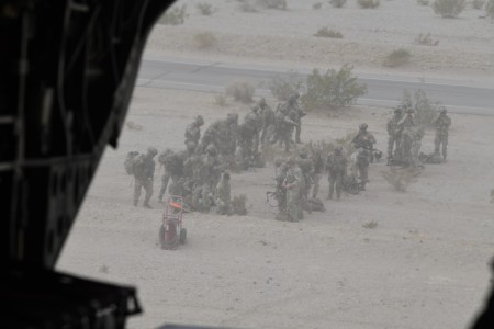 In the chilly, dusty morning at Fort Irwin, California, aka the “Sandbox,” March 11, 2025, four Oregon Army National Guard CH-47F “Chinook" helicopters load Soldiers from the 82nd Airborne Division’s Combat Aviation Brigade. (National Guard photo by Aaron Perkins, OMD Public Affairs)
