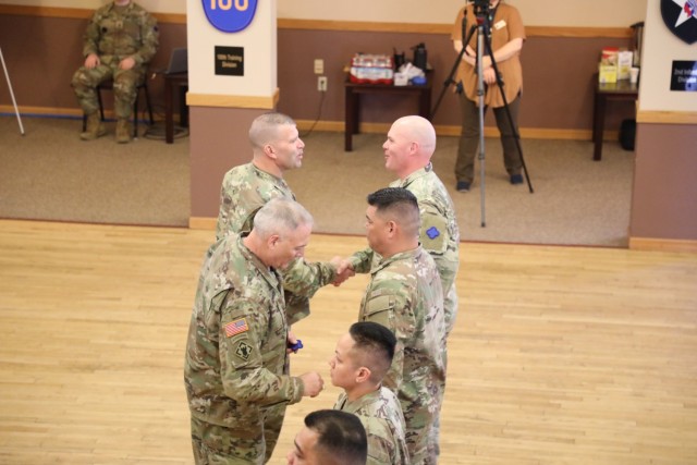 A scene from a patching ceremony held March 13, 2025, is shown in building 905 at Fort McCoy, Wis. Soldiers with U.S. Army Garrison-Fort McCoy traded out the Army Materiel Command patches on their uniforms for the blue clover patch of the 88th...
