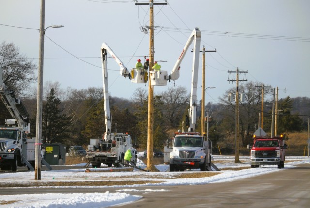 Contractors work on power lines Feb. 10, 2025, on the cantonment area at Fort McCoy, Wis. The work is part of an ongoing electrical grid upgrade at the installation where the post will go from a from a Delta Electrical System to a Wye Electrical...
